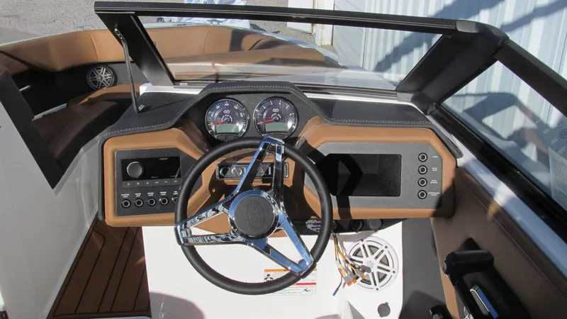Slide: The Image of 2025 Cobalt CS23 boat dashboard with modern steering wheel and instrument panel. - 8