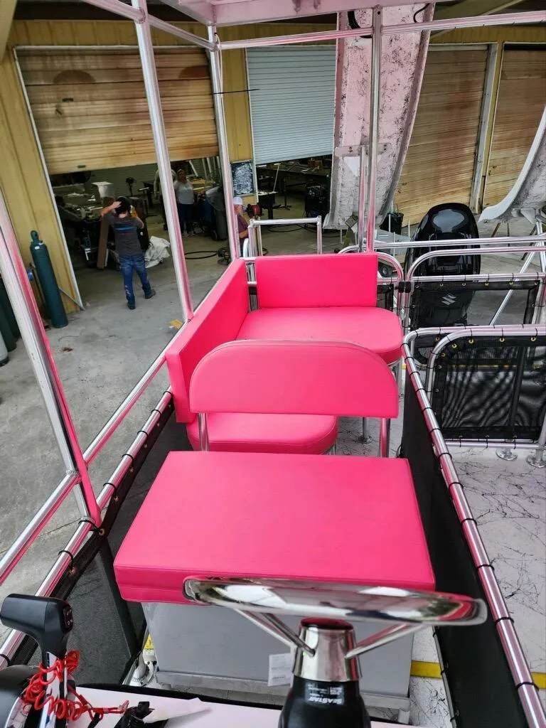 Slide: The Image of 2026 A&M Manufacturing Salty 28 DS with vibrant pink seating and steering wheel. - 5