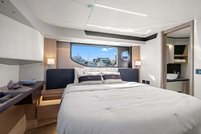 Slide: The Image of Luxurious bedroom interior of 2026 Absolute 48 Coupe yacht with modern design and large window view. - 29
