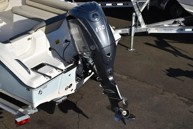 Slide: The Image of 2025 Key West 203 DFS boat with Yamaha 150 outboard motor on trailer. - 11