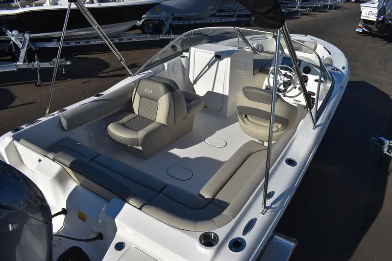 Slide: The Image of 2025 Key West 203 DFS boat interior with seating and steering wheel. - 13
