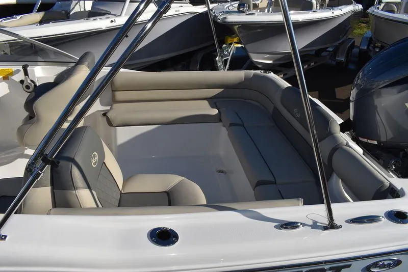 Slide: The Image of 2025 Key West 203 DFS boat interior with cushioned seating and sleek design. - 15