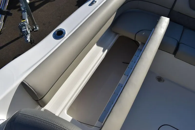 Slide: The Image of 2025 Key West 203 DFS boat interior seating and storage compartment. - 24
