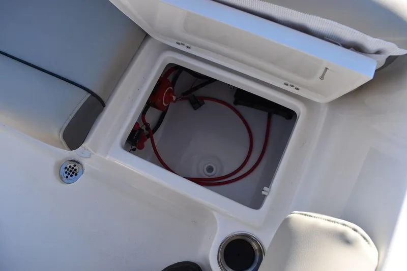 Slide: The Image of 2025 Key West 203 DFS boat storage compartment with wiring and cup holder. - 26