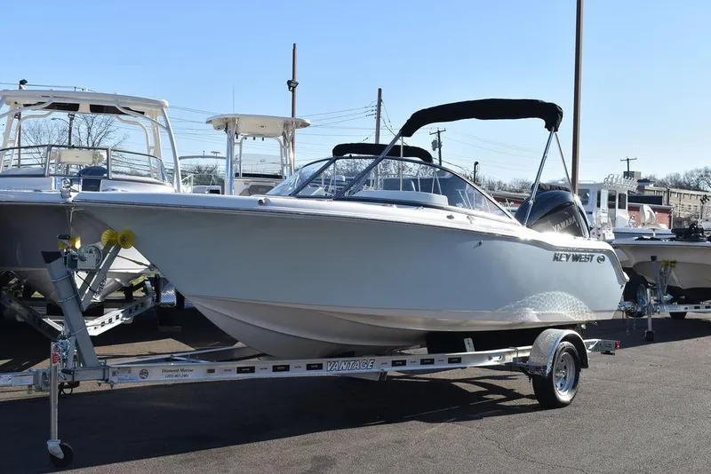 Slide: The Image of 2025 Key West 203 DFS boat on trailer, parked outdoors. - 3