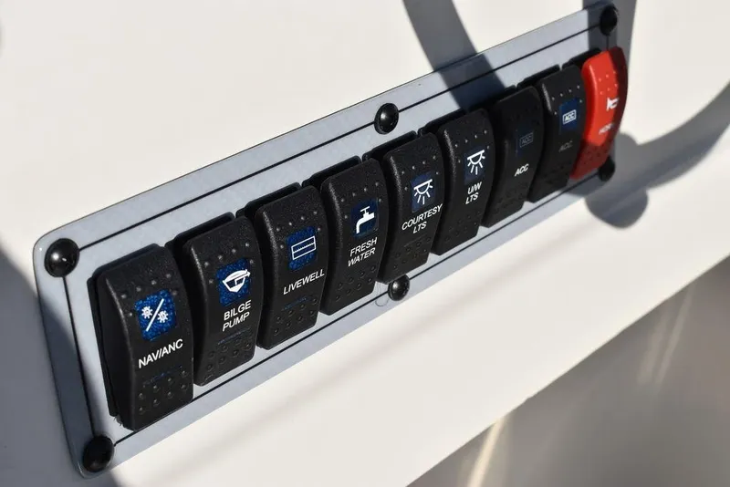 Slide: The Image of Control panel of 2025 Key West 203 DFS boat with labeled switches. - 35