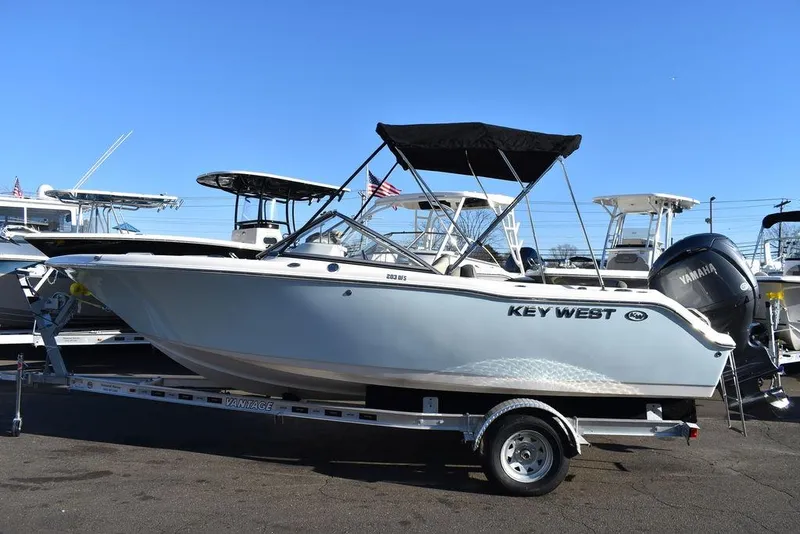 Slide: The Image of 2025 Key West 203 DFS boat on trailer, featuring Yamaha outboard motor. - 4