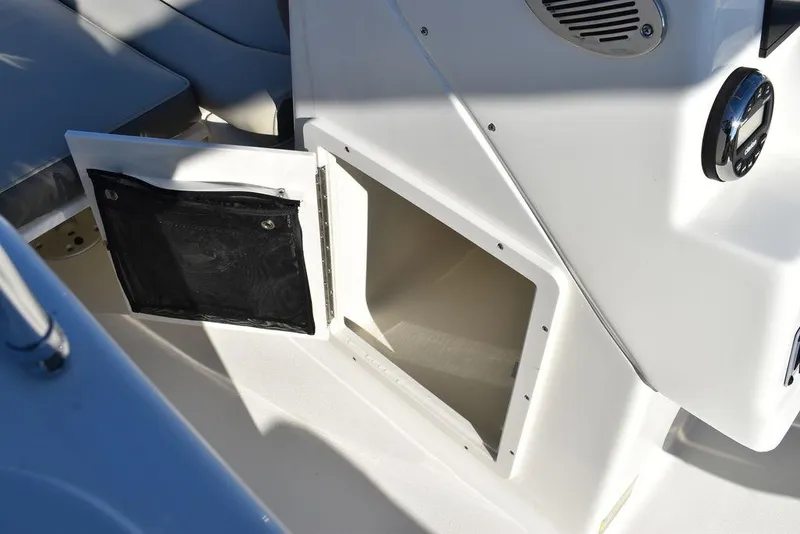 Slide: The Image of 2025 Key West 203 DFS boat storage compartment with open door. - 41