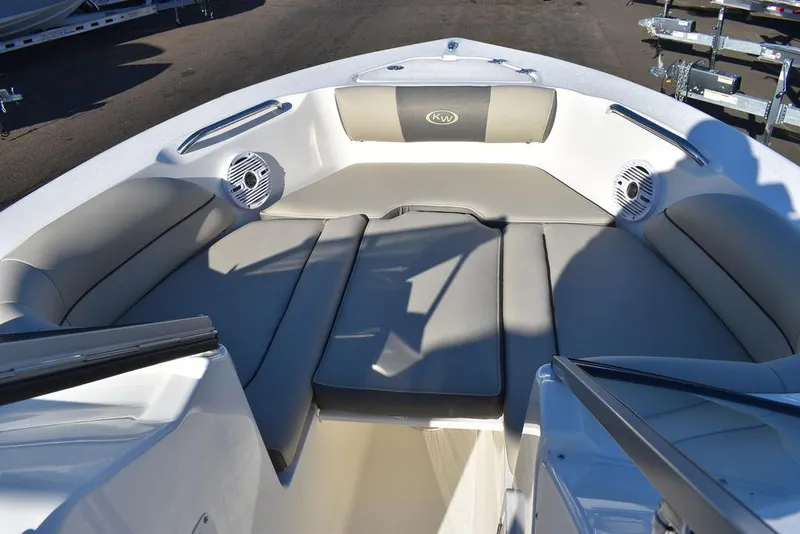 Slide: The Image of 2025 Key West 203 DFS boat interior with cushioned seating and speakers. - 42