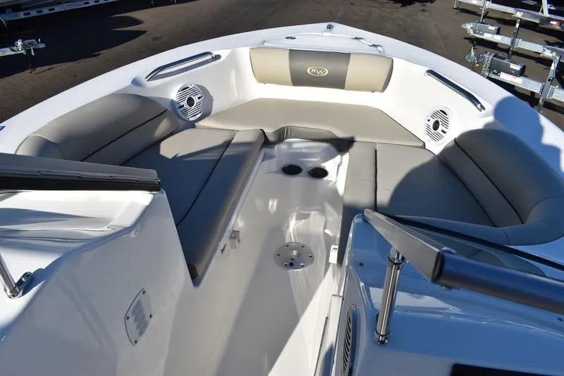 Slide: The Image of 2025 Key West 203 DFS boat interior with cushioned seating and cup holders. - 43