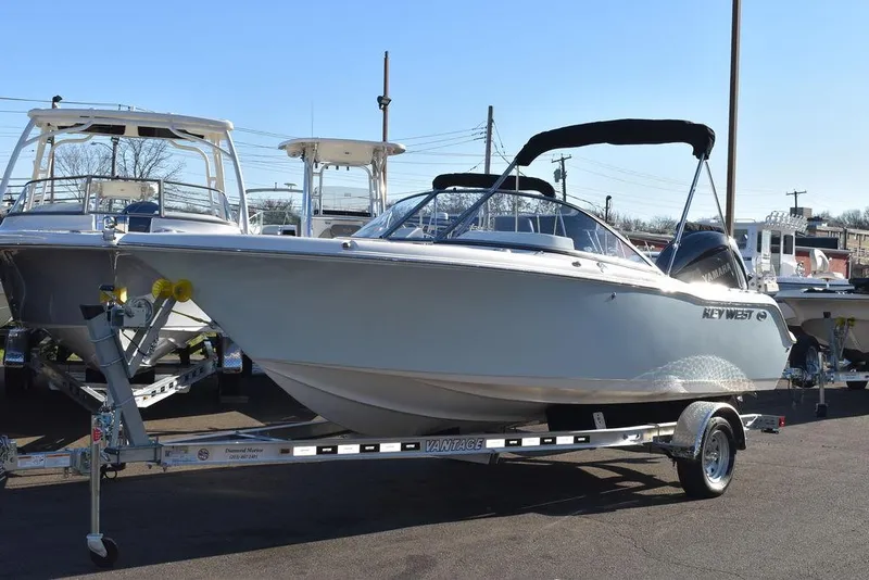 Slide: The Image of 2025 Key West 203 DFS boat on trailer, displayed outdoors. - 5