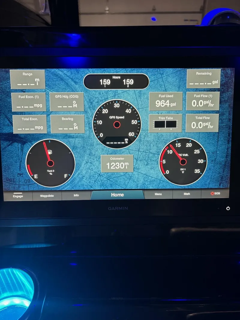 Slide: The Image of Dashboard display of a 2022 Tidewater 320 CC Adventure boat with speed and fuel metrics. - 7
