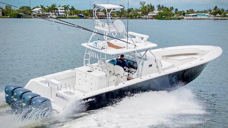 Slide: The Image of 2017 SeaHunter 45 Tournament boat cruising on water with multiple outboard engines. - 10