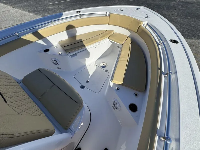 Slide: The Image of 2025 Sportsman Open 212 boat interior with tan seating and modern design. - 15
