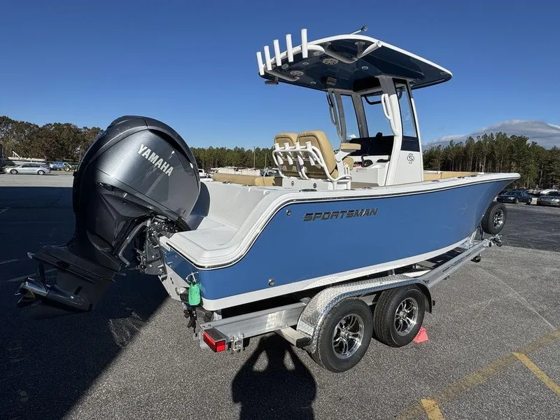 Slide: The Image of 2025 Sportsman Open 212 boat on trailer with Yamaha engine, parked outdoors. - 4