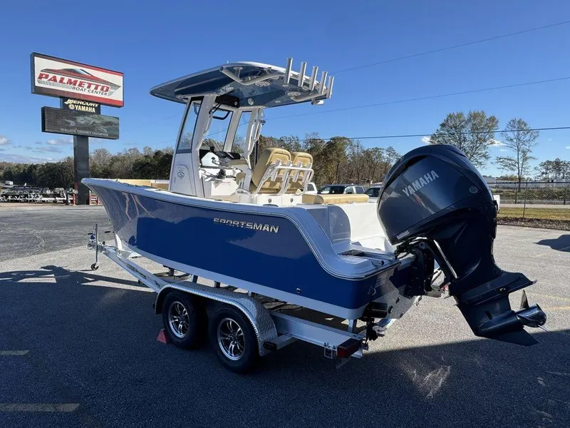 Slide: The Image of 2025 Sportsman Open 212 boat with Yamaha engine on trailer in dealership lot. - 5