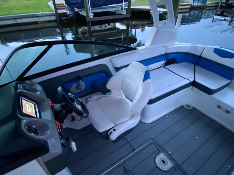 Slide: The Image of 2020 Chaparral 223 Vortex VRX boat interior with modern seating and dashboard. - 10