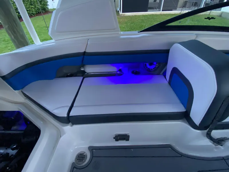 Slide: The Image of 2020 Chaparral 223 Vortex VRX boat interior with blue LED lighting. - 12