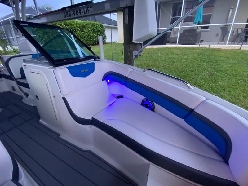 Slide: The Image of 2020 Chaparral 223 Vortex VRX boat interior with blue LED lighting. - 13