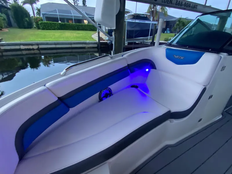 Slide: The Image of 2020 Chaparral 223 Vortex VRX boat interior with blue LED lighting. - 14