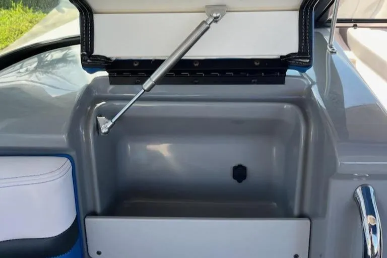 Slide: The Image of Open storage compartment on 2020 Chaparral 223 Vortex VRX boat. - 18