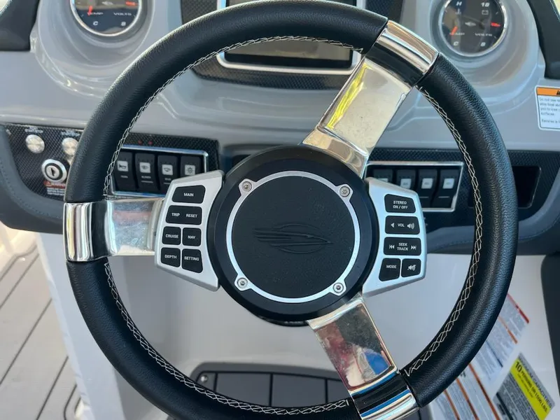 Slide: The Image of Steering wheel of 2020 Chaparral 223 Vortex VRX boat with control buttons. - 19