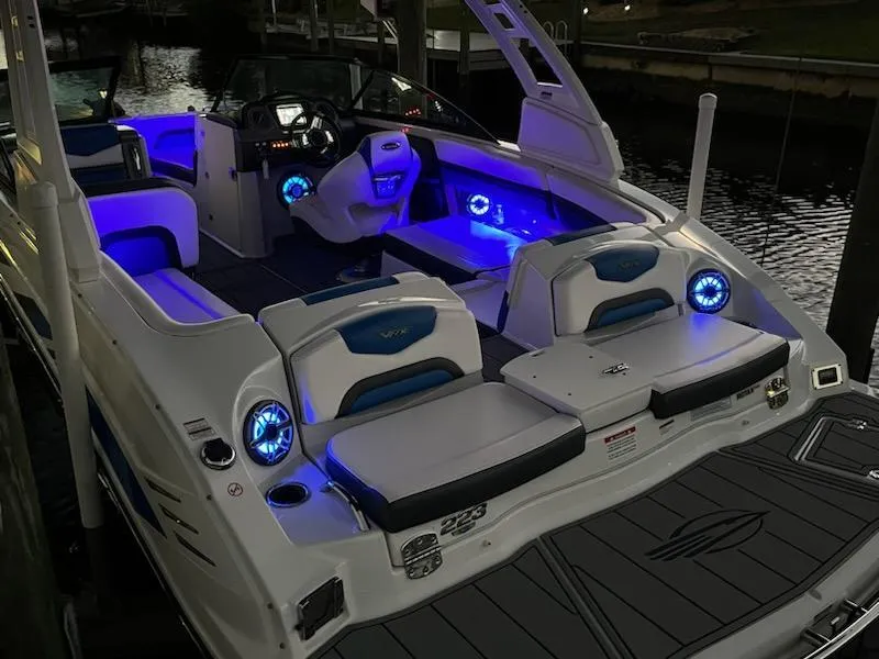 Slide: The Image of 2020 Chaparral 223 Vortex VRX boat with illuminated interior and sleek design. - 26