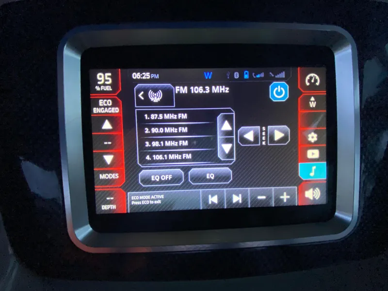 Slide: The Image of 2020 Chaparral 223 Vortex VRX dashboard display showing FM radio settings and eco mode. - 29