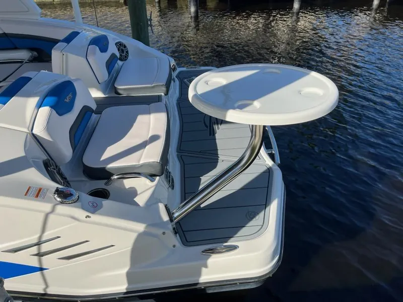 Slide: The Image of 2020 Chaparral 223 Vortex VRX boat with seating and table on deck. - 31