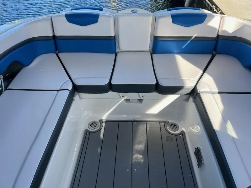 Slide: The Image of 2020 Chaparral 223 Vortex VRX boat interior with blue and white seating. - 34
