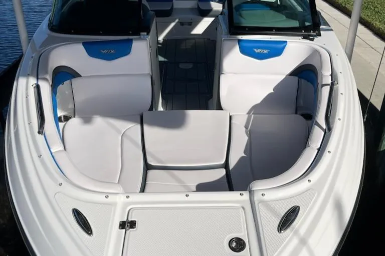 Slide: The Image of 2020 Chaparral 223 Vortex VRX boat interior with white and blue seating. - 36