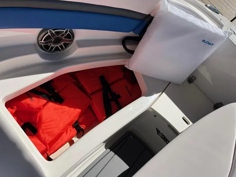 Slide: The Image of 2020 Chaparral 223 Vortex VRX boat storage with orange life jackets. - 37