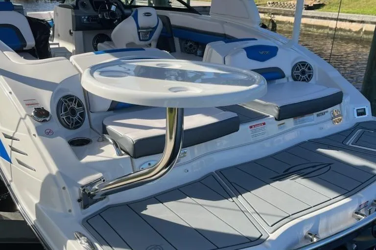 Slide: The Image of 2020 Chaparral 223 Vortex VRX boat interior with seating and table. - 39