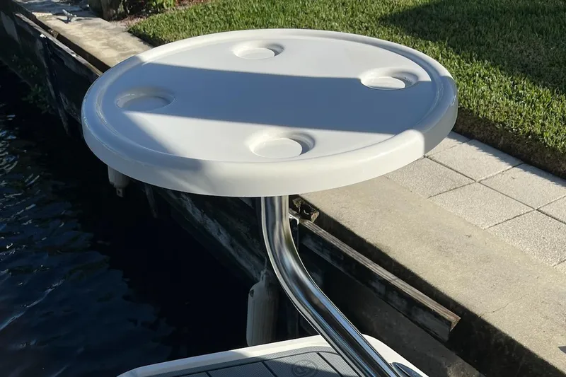 Slide: The Image of Round table on Chaparral 223 Vortex VRX boat, 2020 model, dockside view. - 40
