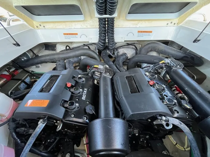 Slide: The Image of 2020 Chaparral 223 Vortex VRX engine compartment with dual Rotax engines. - 46