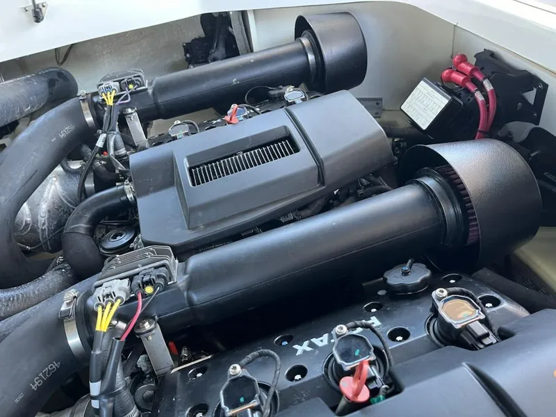 Slide: The Image of 2020 Chaparral 223 Vortex VRX engine compartment, showcasing dual air intakes and wiring. - 49