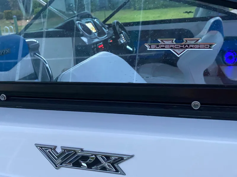 Slide: The Image of 2020 Chaparral 223 Vortex VRX boat interior with supercharged emblem and VRX logo. - 5