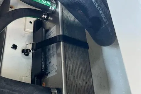 Slide: The Image of Engine compartment of 2020 Chaparral 223 Vortex VRX with visible hoses and components. - 52