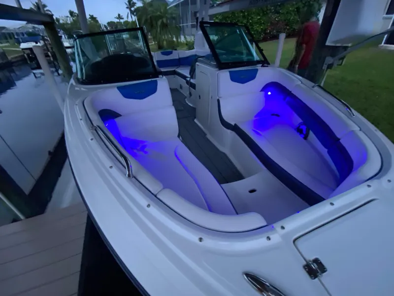 Slide: The Image of 2020 Chaparral 223 Vortex VRX boat with illuminated interior and sleek design. - 8