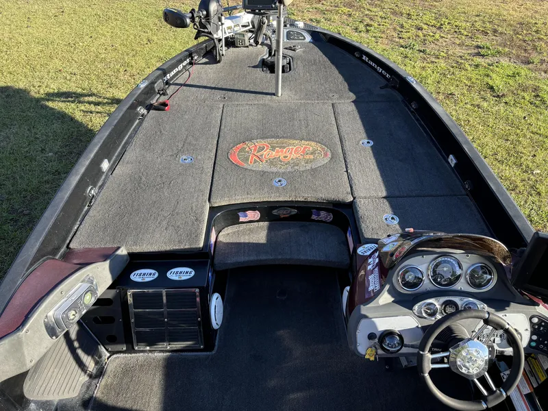 Slide: The Image of 2009 Ranger Z520 Comanche boat interior with steering wheel and control panel. - 15