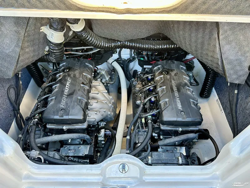 Slide: The Image of 2019 Yamaha AR240 boat engine compartment with dual high-output engines. - 10