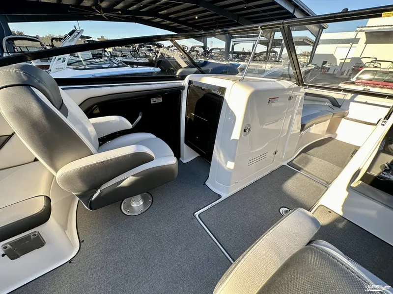 Slide: The Image of 2019 Yamaha AR240 boat interior with seating and helm, showcasing modern design. - 5