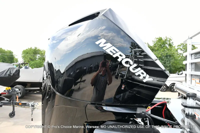 Slide: The Image of 2025 Ranger 223FC with 200HP Mercury 4 Stroke engine, outdoor display. - 14