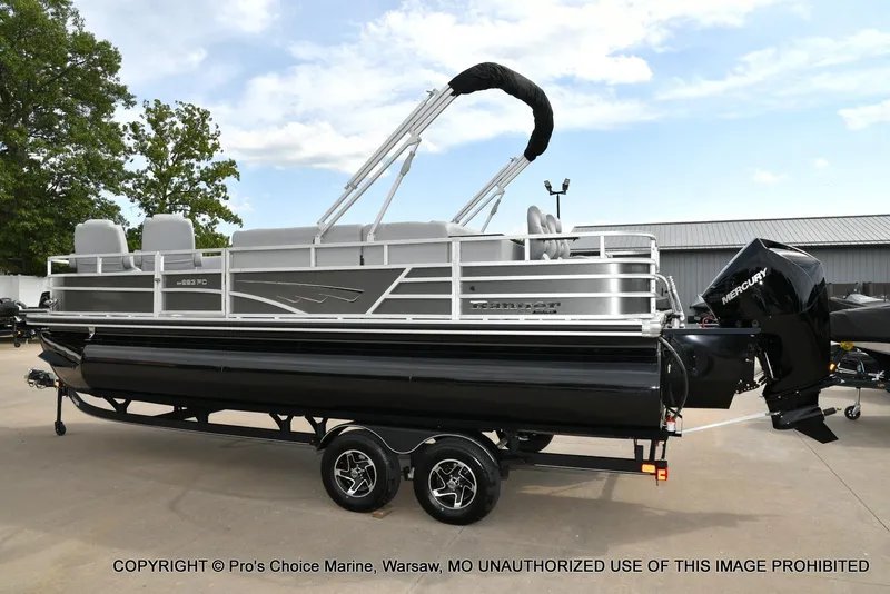 Slide: The Image of 2025 Ranger 223FC pontoon boat with 200HP Mercury 4 Stroke engine, parked outdoors. - 17