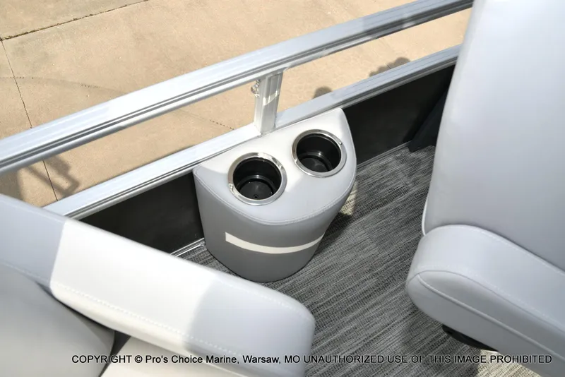 Slide: The Image of Interior of 2025 Ranger 223FC boat with dual cup holders and gray seating. - 24