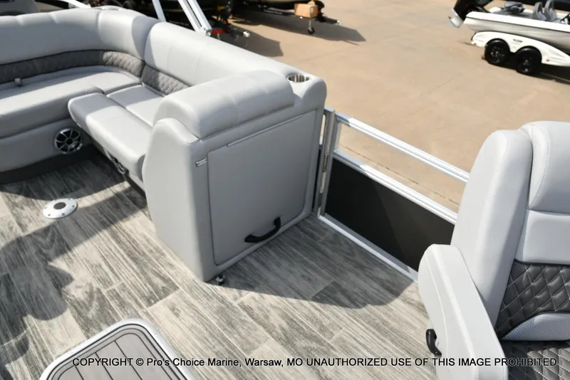 Slide: The Image of Interior of 2025 Ranger 223FC boat with gray seating and wood-style flooring. - 25