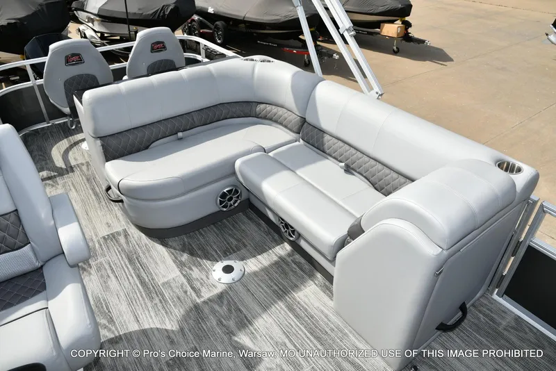 Slide: The Image of 2025 Ranger 223FC boat interior with gray seating and modern design. - 27