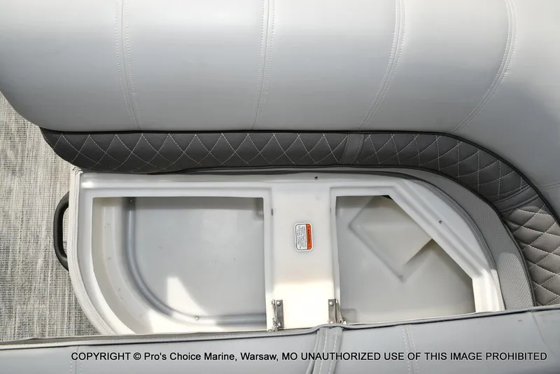 Slide: The Image of 2025 Ranger 223FC boat seat storage compartment with quilted upholstery. - 29