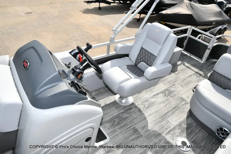 Slide: The Image of 2025 Ranger 223FC boat interior with steering console and plush seating. - 33