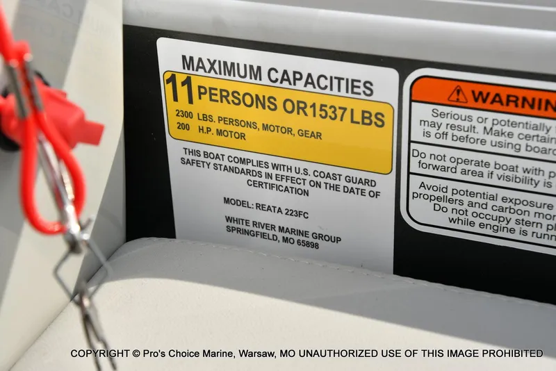 Slide: The Image of Capacity label on 2025 Ranger 223FC boat, 11 persons or 1537 lbs, 200 HP motor. - 36